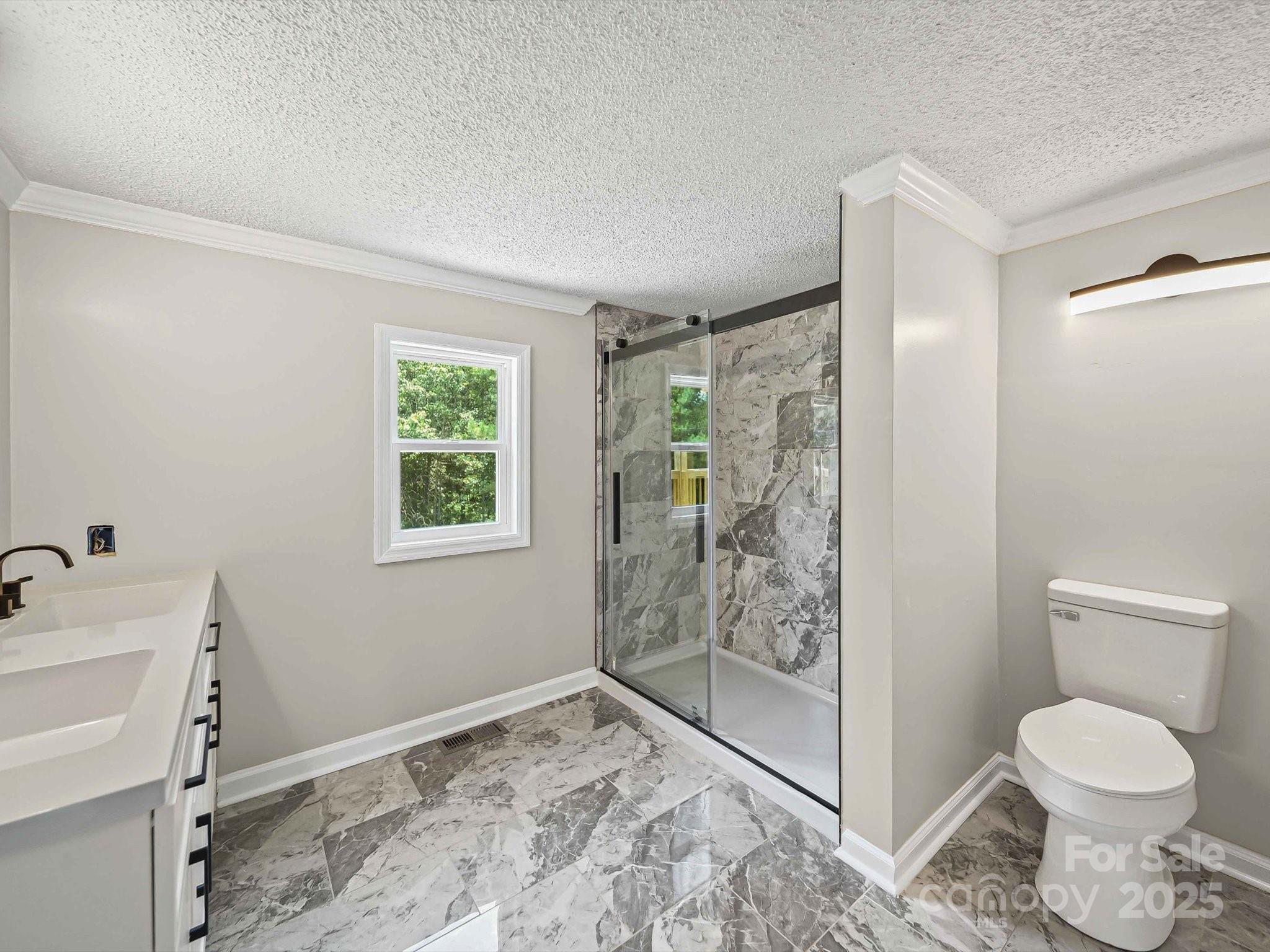 147 Xienghone Road Mount Gilead, NC 27306 - Photo 15 of 22 a bathroom with a sink toilet and shower