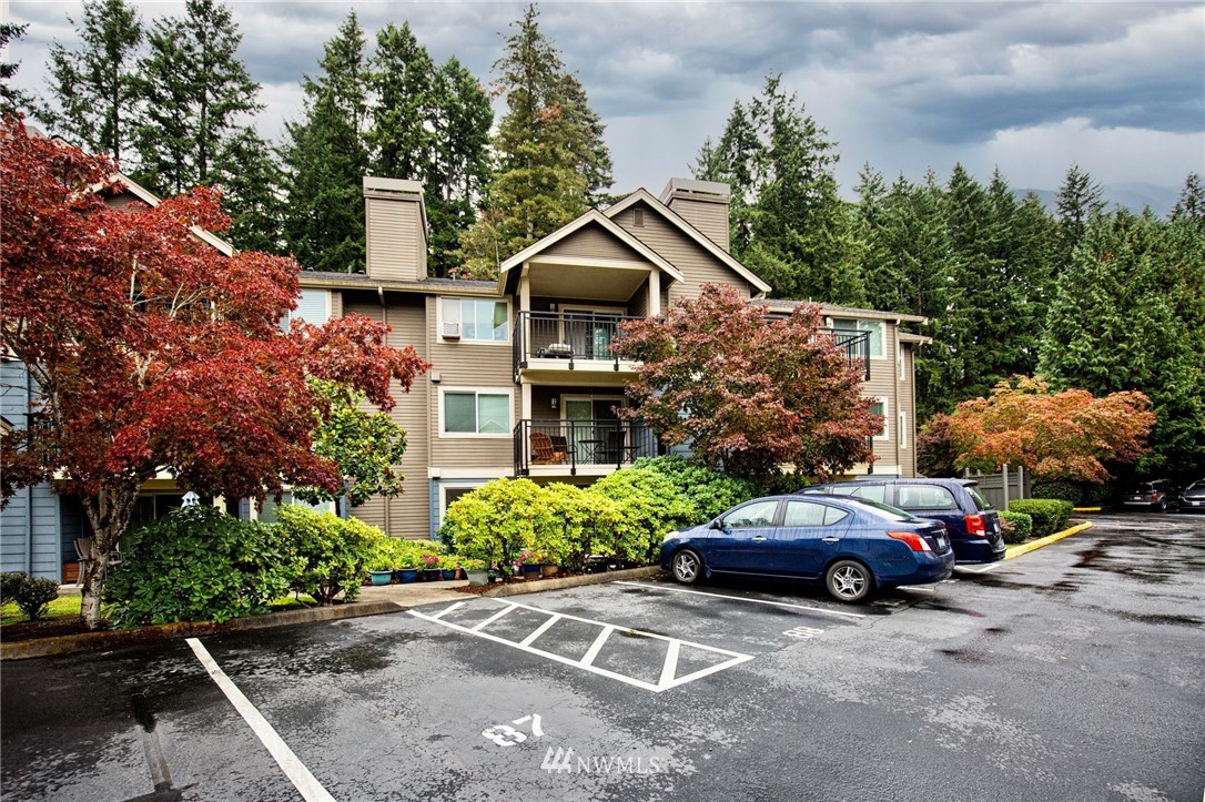 19410 Bothell Way Northeast, Unit D201 Bothell, WA 98011 - Photo 1 of 22 a car parked in front of a house
