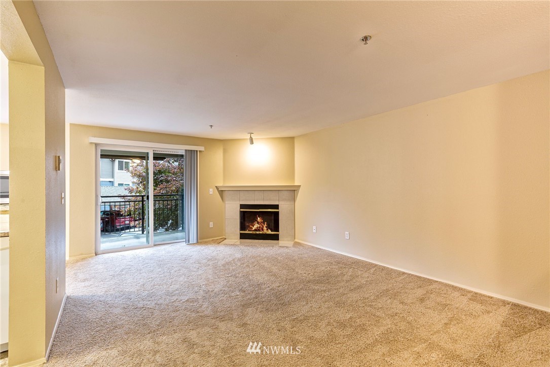 19410 Bothell Way Northeast, Unit D201 Bothell, WA 98011 - Photo 2 of 22 a view of an empty room with a window