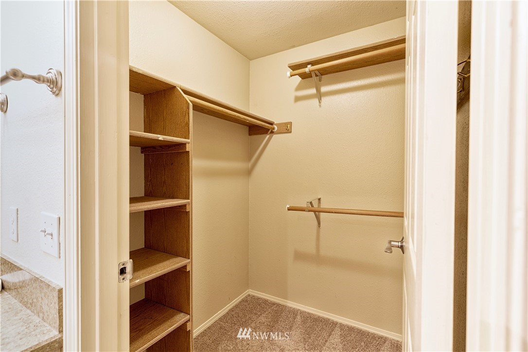 19410 Bothell Way Northeast, Unit D201 Bothell, WA 98011 - Photo 11 of 22 a view of walk in closet with empty racks