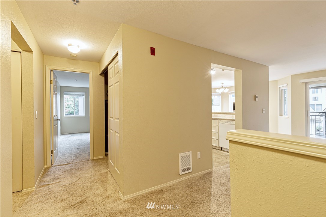 19410 Bothell Way Northeast, Unit D201 Bothell, WA 98011 - Photo 17 of 22 a view of a livingroom with wooden floor and a bathroom