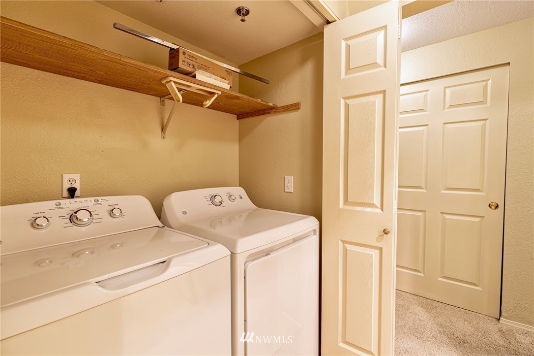 19410 Bothell Way Northeast, Unit D201 Bothell, WA 98011 - Photo 18 of 22 a utility room with dryer and washer