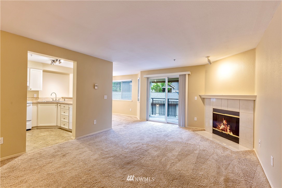 19410 Bothell Way Northeast, Unit D201 Bothell, WA 98011 - Photo 3 of 22 a view of a livingroom with a fireplace