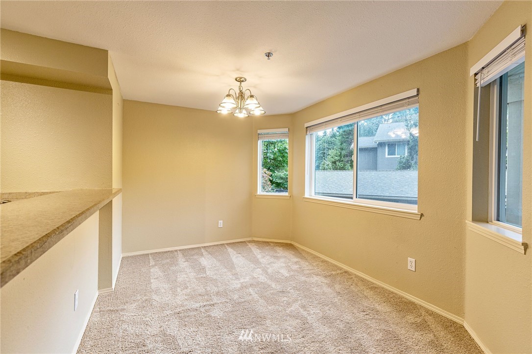 19410 Bothell Way Northeast, Unit D201 Bothell, WA 98011 - Photo 8 of 22 a view of an empty room with a window