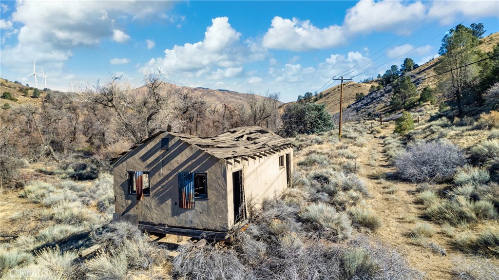 1 Cameron Canyon Road Tehachapi, CA 93501 - Photo 19 of 26 a view of a house with a yard and wooden fence