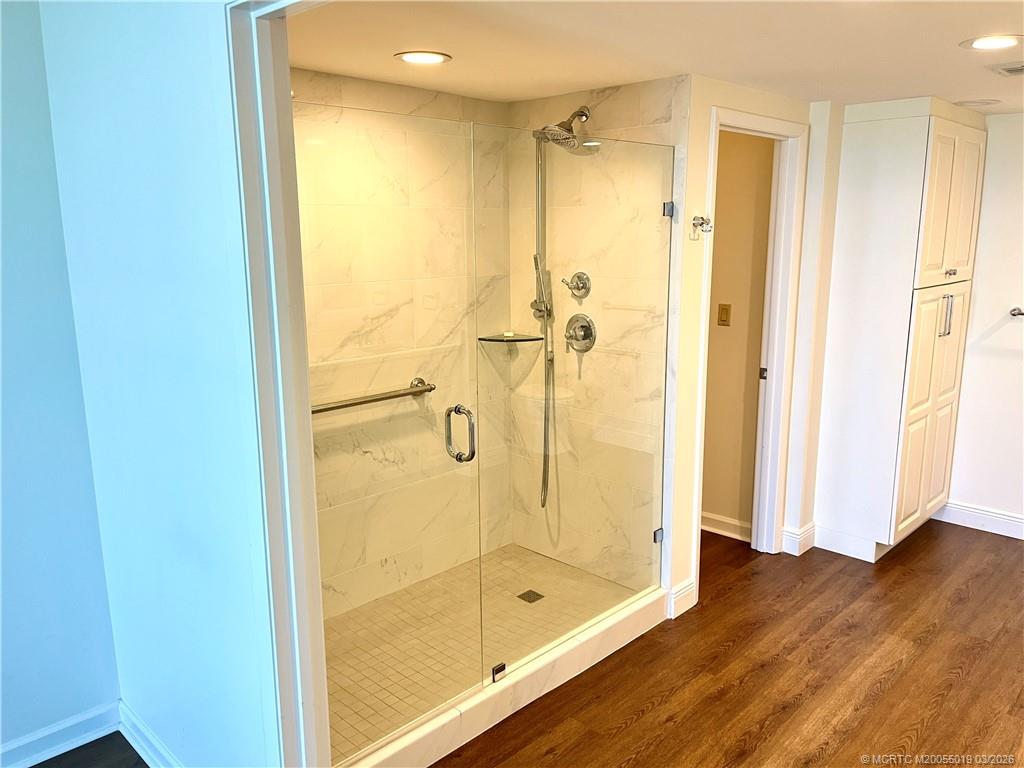 579 Northeast Plantation Road, Unit S303 Jensen Beach, FL 34957 - Photo 12 of 25 Large walk-in shower