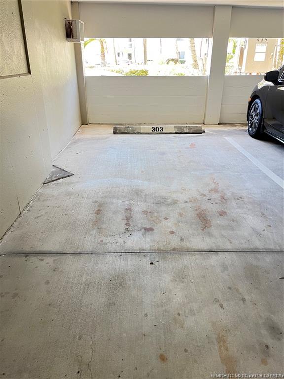 579 Northeast Plantation Road, Unit S303 Jensen Beach, FL 34957 - Photo 21 of 25 Covered parking space