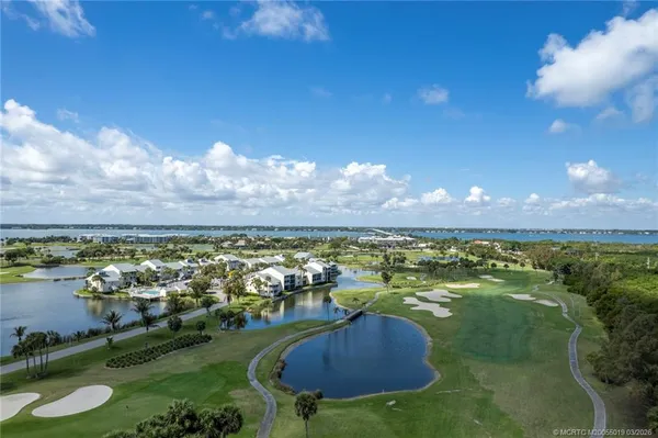a view of a swimming pool with sitting area