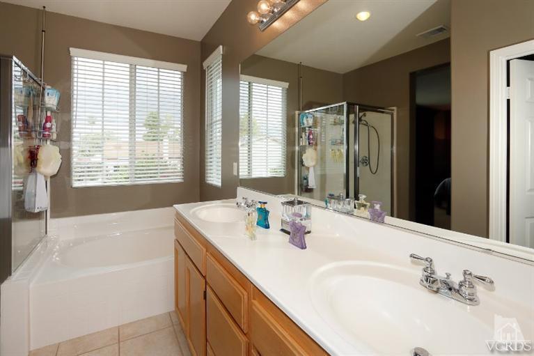 1636 Marigold Lane Simi Valley, CA 93065 - Photo 13 of 21 a bathroom with a tub sink and mirror