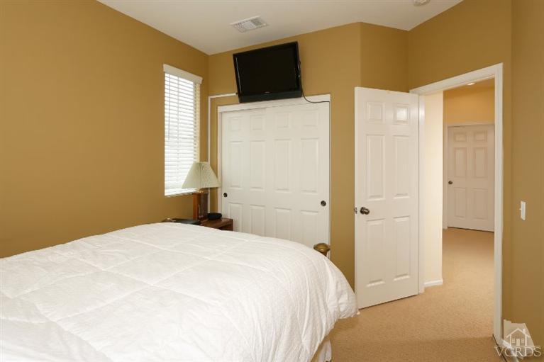 1636 Marigold Lane Simi Valley, CA 93065 - Photo 14 of 21 a bedroom with a bed and a flat screen tv