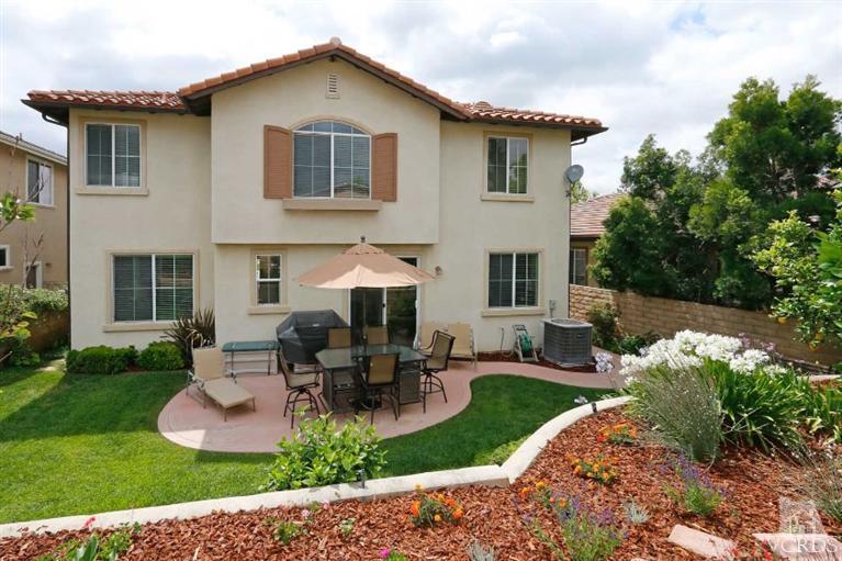 1636 Marigold Lane Simi Valley, CA 93065 - Photo 16 of 21 a view of a house with backyard sitting area and garden