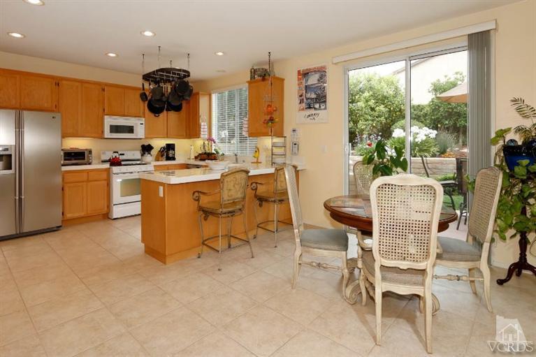 1636 Marigold Lane Simi Valley, CA 93065 - Photo 6 of 21 a view of a dining room with furniture a chandelier and kitchen view