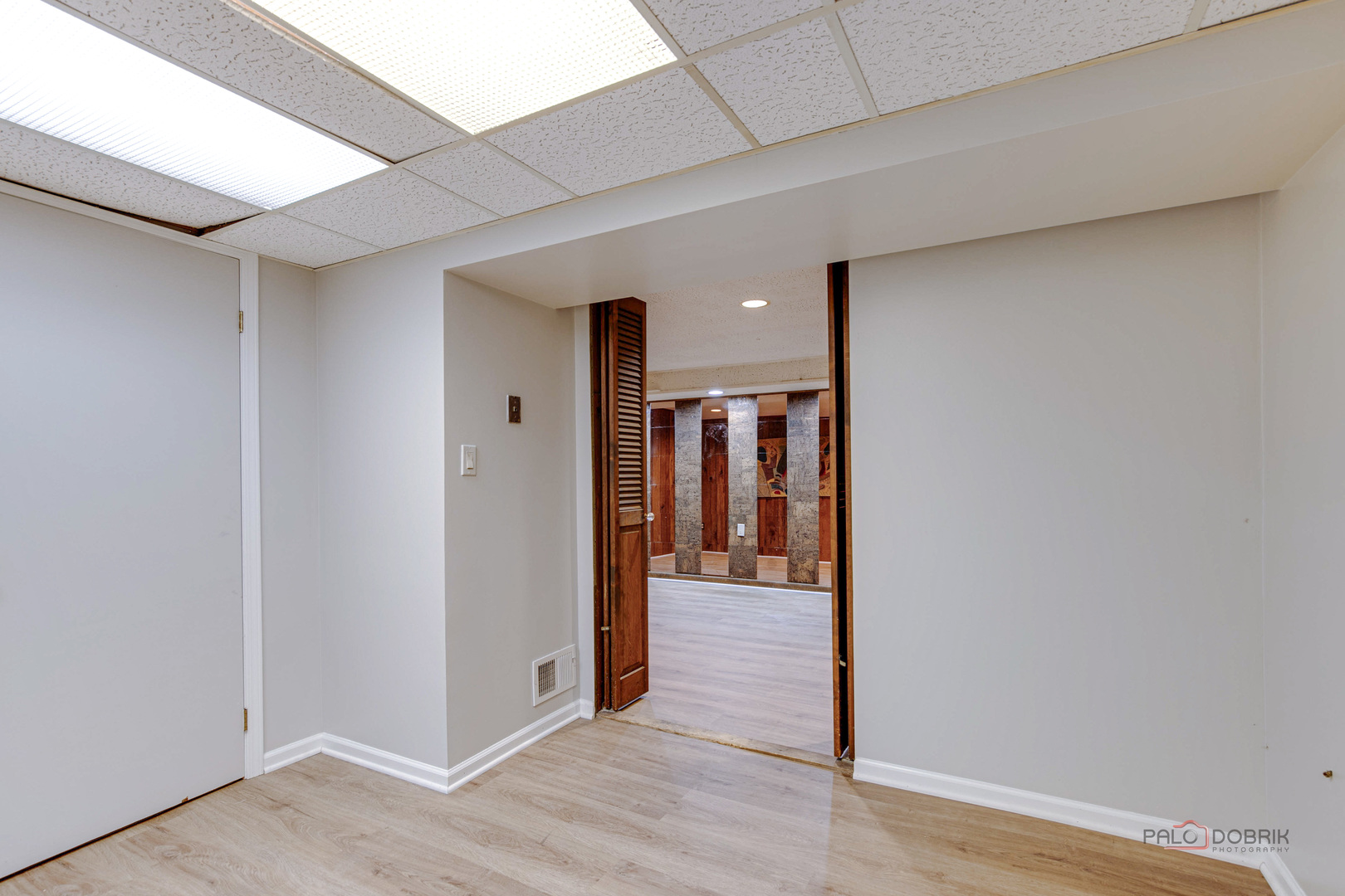838 Inverrary Lane, Unit 838 Deerfield, IL 60015 - Photo 25 of 25 a view of a hallway with wooden floor