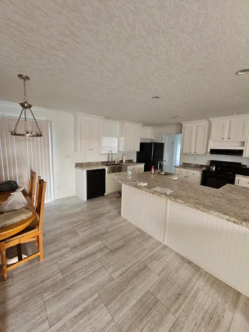 a living room with furniture gym equipment and a window