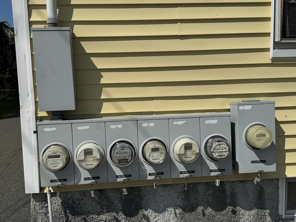24-28 Hall Street Fall River, MA 02724 - Photo 3 of 18 a front view of a house with a stove and a kitchen view