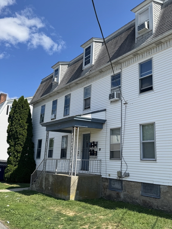 24-28 Hall Street Fall River, MA 02724 - Photo 10 of 18 a front view of a house with a yard