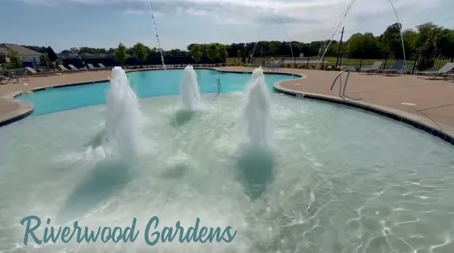 a view of a swimming pool and a yard
