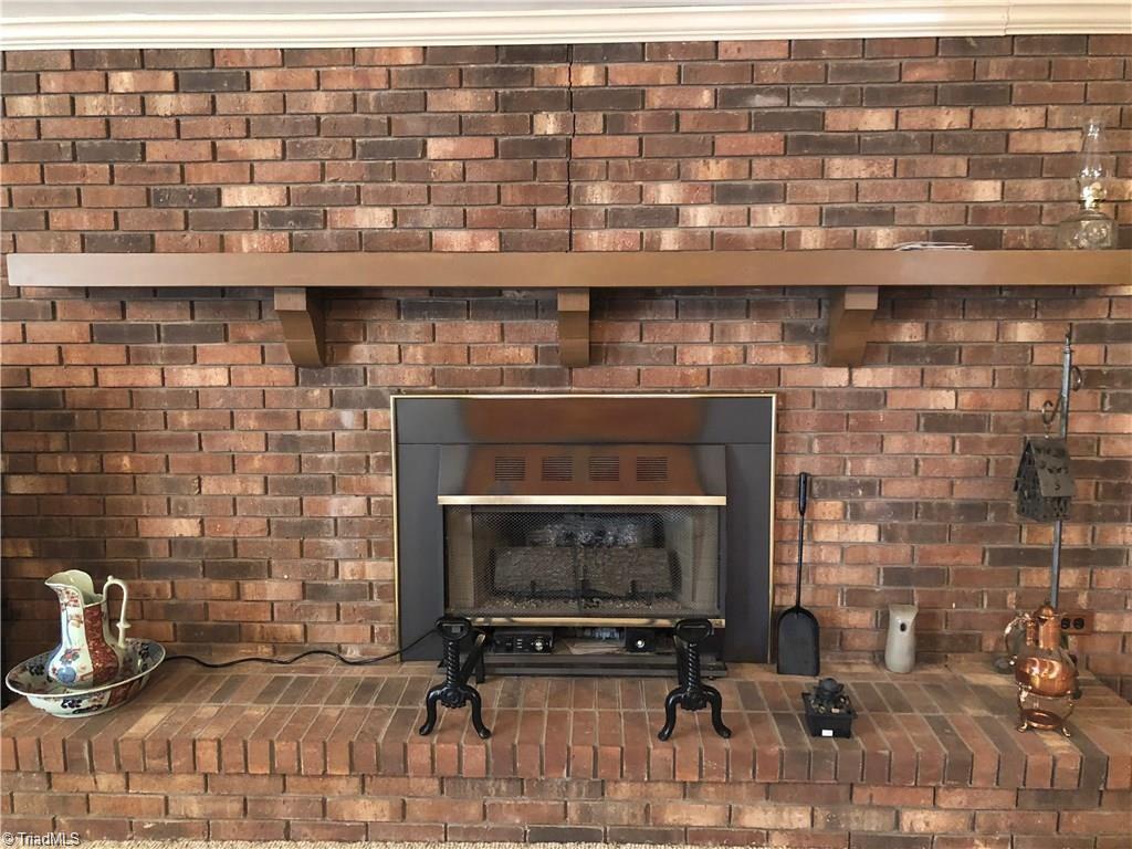 2290 Simmons Road Westfield, NC 27053 - Photo 17 of 26 large brick fire place with gas logs in family room/den