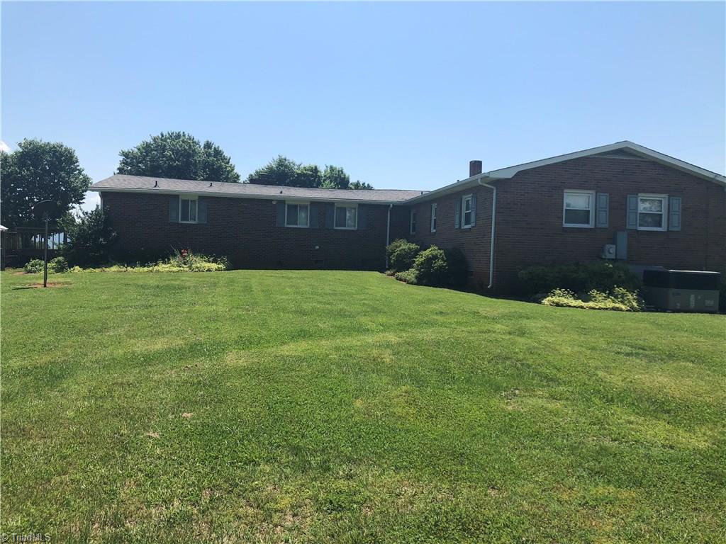 Side of home shows 1984 addition of den, full bath, laundry room, and walk in closet. 