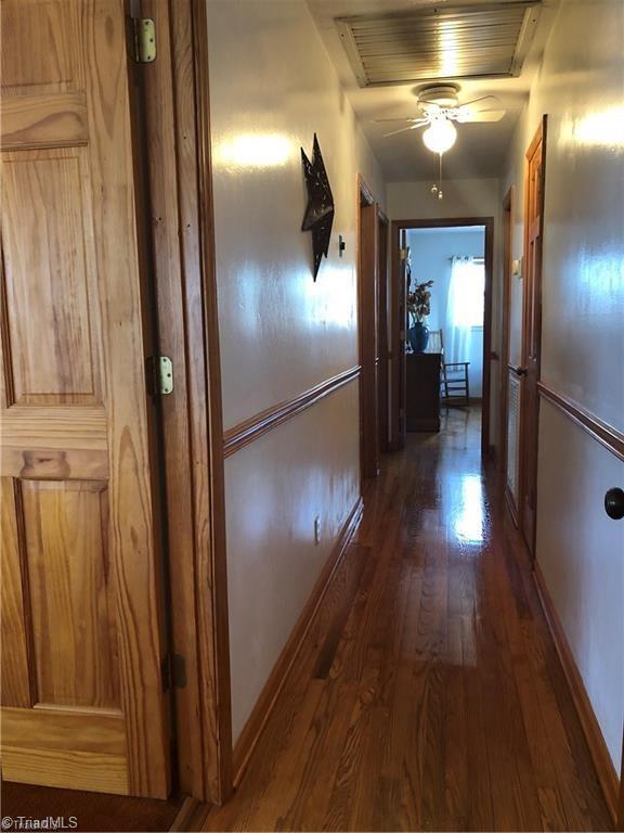 2290 Simmons Road Westfield, NC 27053 - Photo 21 of 26 beautiful wood floors in all bedrooms and hallway.
