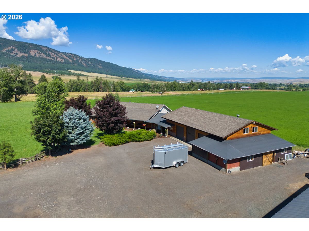 a view of a patio with furniture and garden