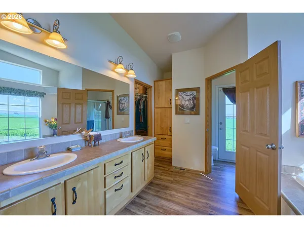 a bathroom with a granite countertop sink mirror and double