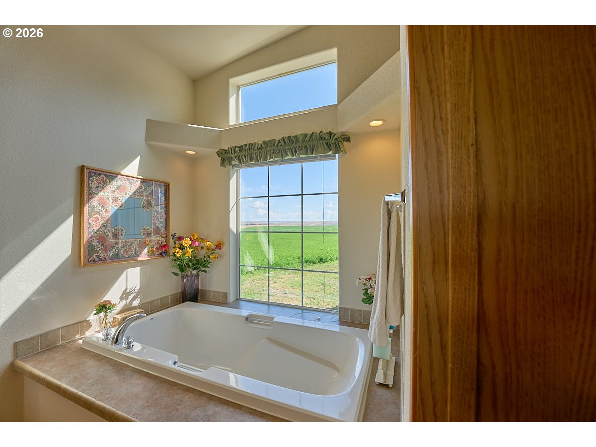 67079 Lostine River Road Lostine, OR 97857 - Photo 19 of 41 a bathroom with a tub and shower