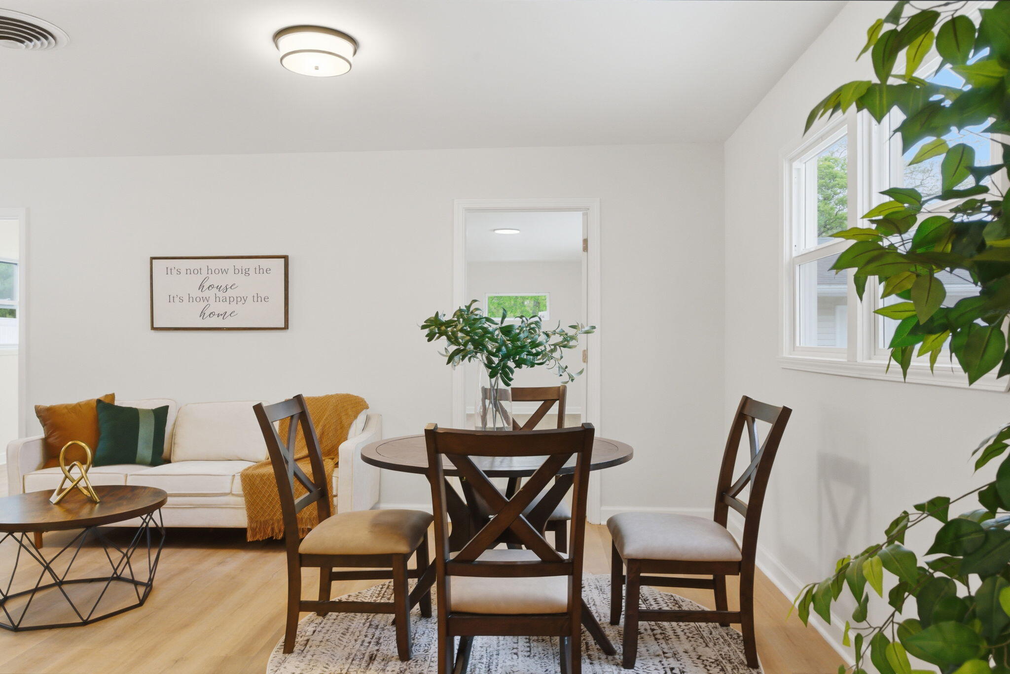 207 Harrington Avenue Crown Point, IN 46307 - Photo 9 of 21 a dining room with furniture and a potted plant