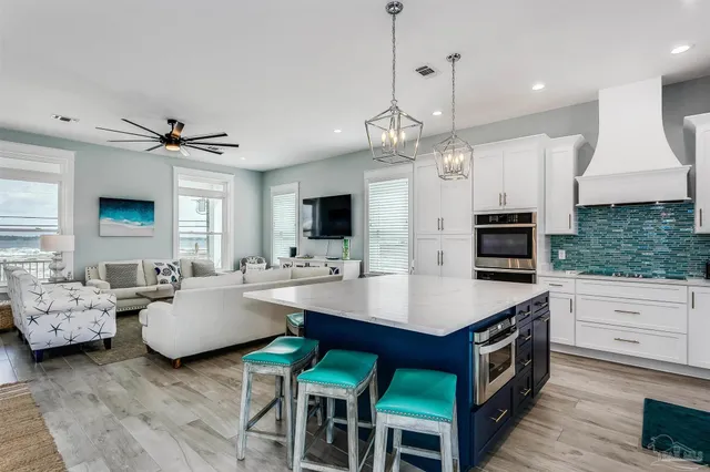 a view of a patio with table and chairs and wooden floor