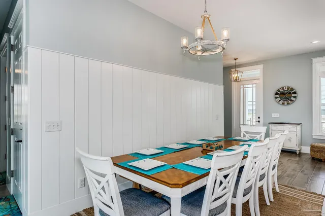a view of a room with wooden floor and windows
