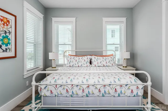 a bedroom with a bed and flat screen tv