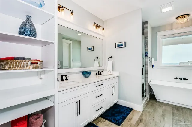 a bedroom with a bed and chandelier