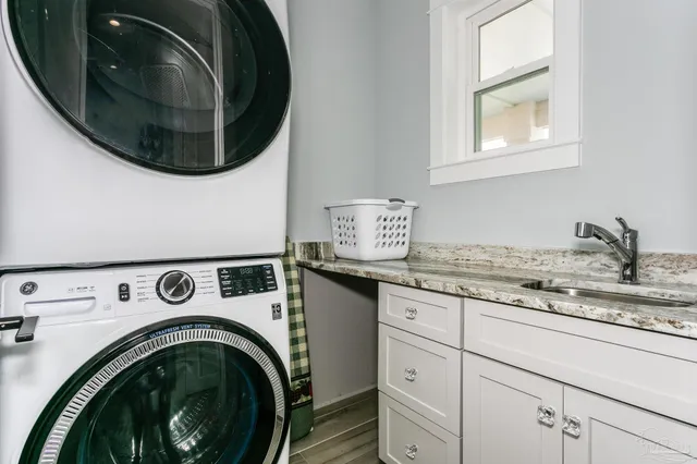 a view of a house with swimming pool and sitting area