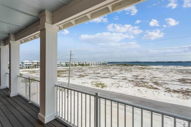 a roof deck with couch and chairs