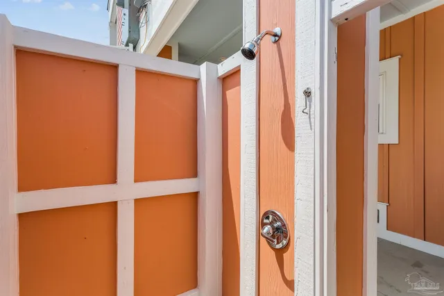 a front view of a building with outdoor seating