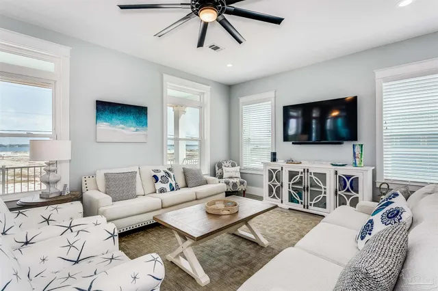 a kitchen with a sink a refrigerator and cabinets