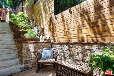a view of a balcony with chairs