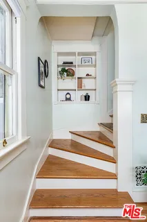 a view of staircase and living room