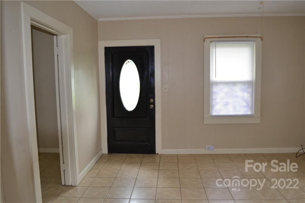 2751 Lail Road Morganton, NC 28655 - Photo 11 of 32 a view of a hallway with wooden floor and a mirror
