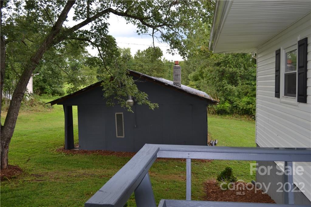 2751 Lail Road Morganton, NC 28655 - Photo 25 of 32 a wooden fence with some potted plants