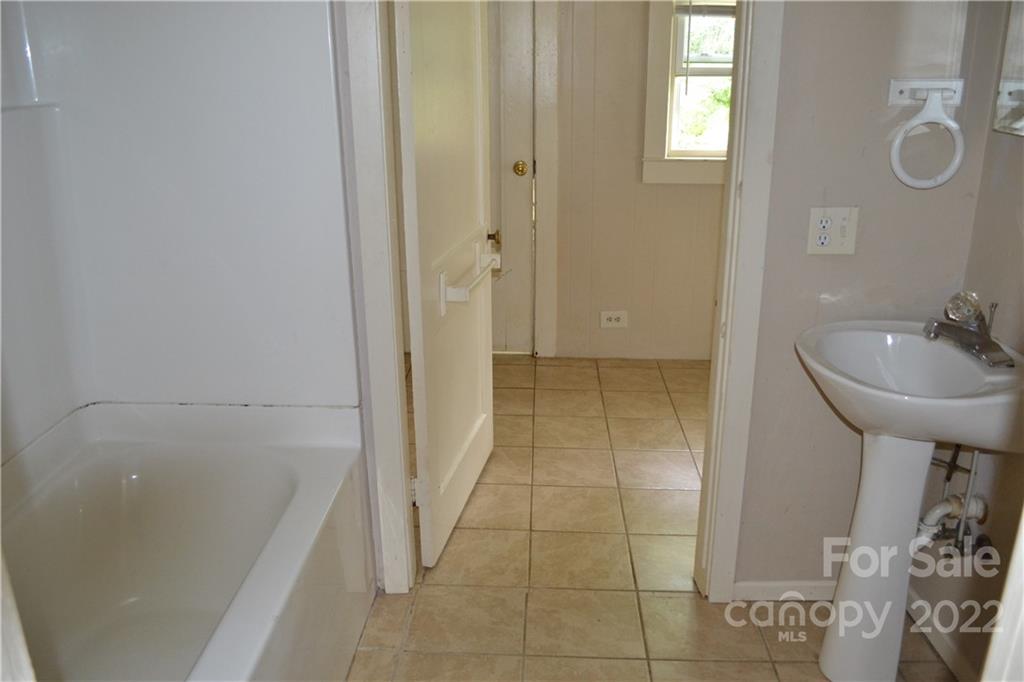2751 Lail Road Morganton, NC 28655 - Photo 10 of 32 a bathroom with a sink a toilet and shower