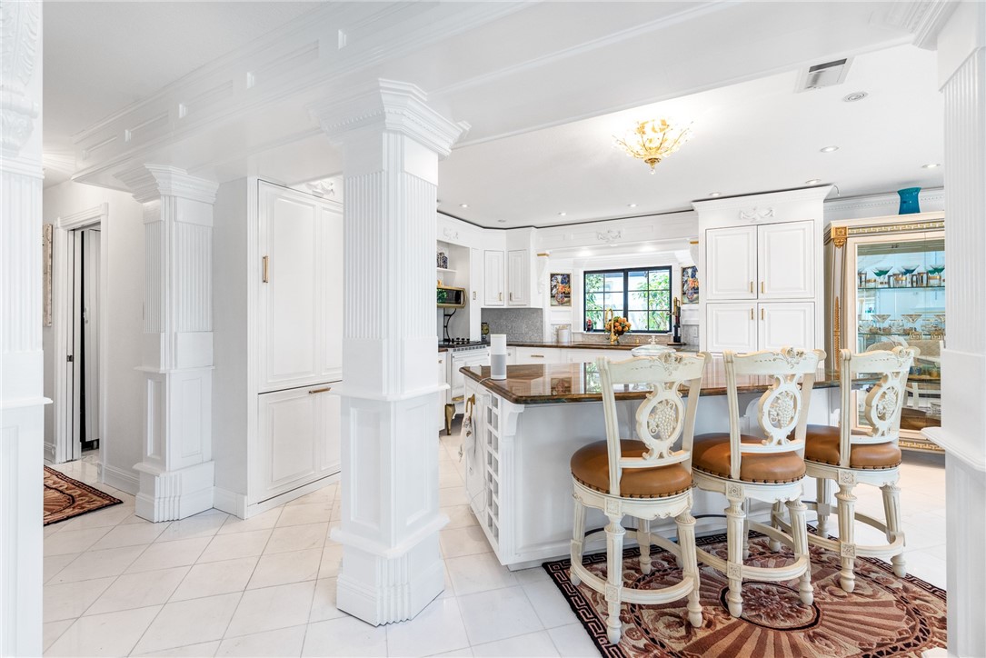15910 El Soccorro Loop Corpus Christi, TX 78418 - Photo 15 of 40 a kitchen with stainless steel appliances kitchen island granite countertop a refrigerator and cabinets