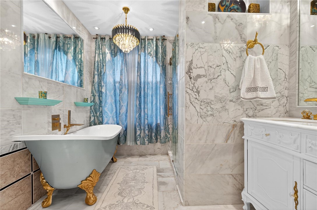 15910 El Soccorro Loop Corpus Christi, TX 78418 - Photo 24 of 40 a bathroom with a sink and a mirror