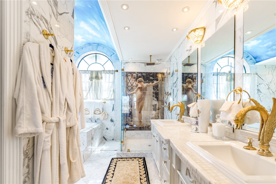 15910 El Soccorro Loop Corpus Christi, TX 78418 - Photo 33 of 40 a spacious bathroom with a double vanity sink a mirror and a shower