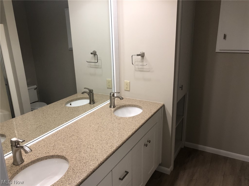 4931 North Barton Road North Ridgeville, OH 44039 - Photo 17 of 27 The master bathroom has a double-bowl vanity, mirror, medicine cabinet & towel cabinet.