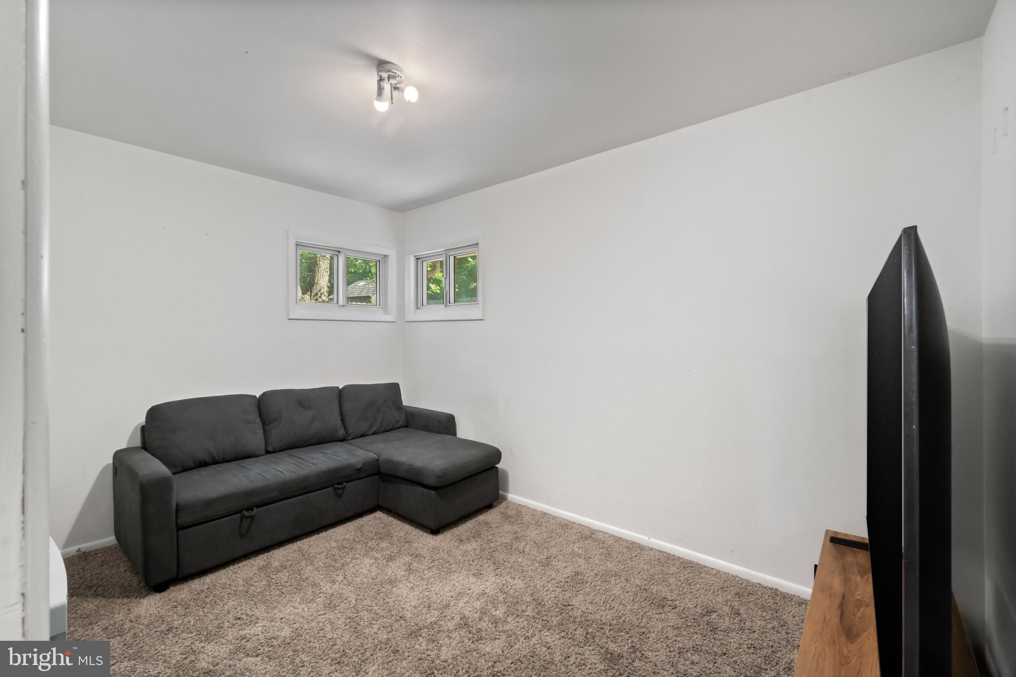 415 Baylor Road Glen Burnie, MD 21061 - Photo 10 of 29 a living room with furniture and a window