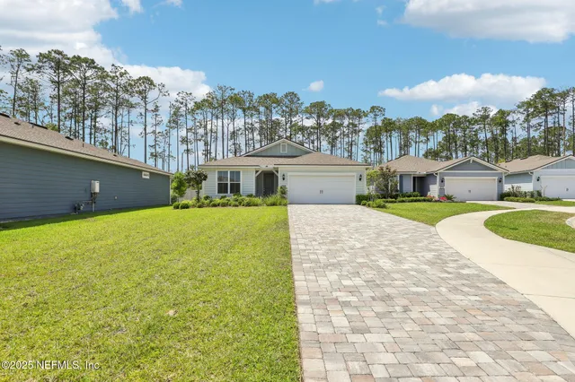 a view of house with a swimming pool