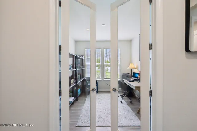 a view of a workspace with furniture