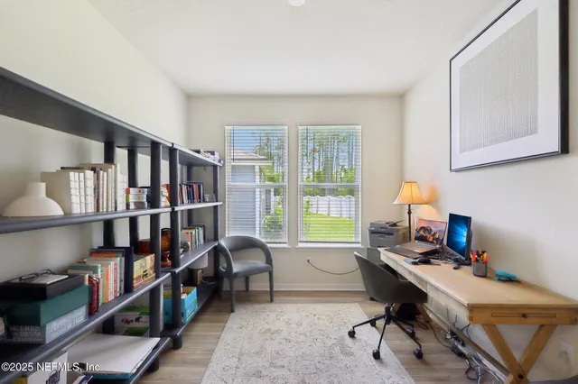 a bedroom with a bed and a lamp