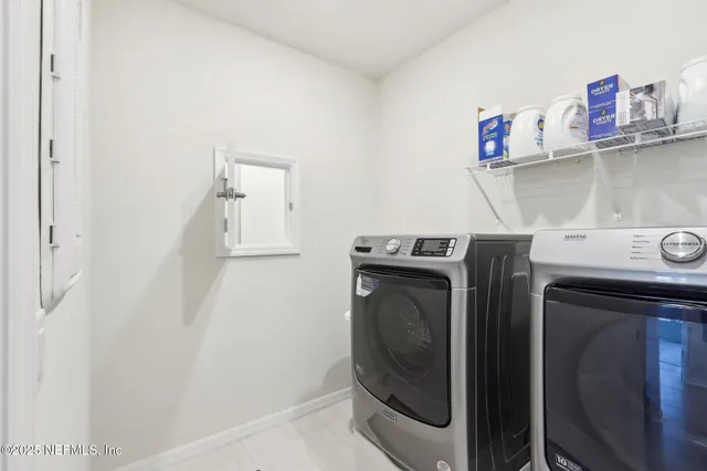 a bathroom with a sink double vanity and a mirror